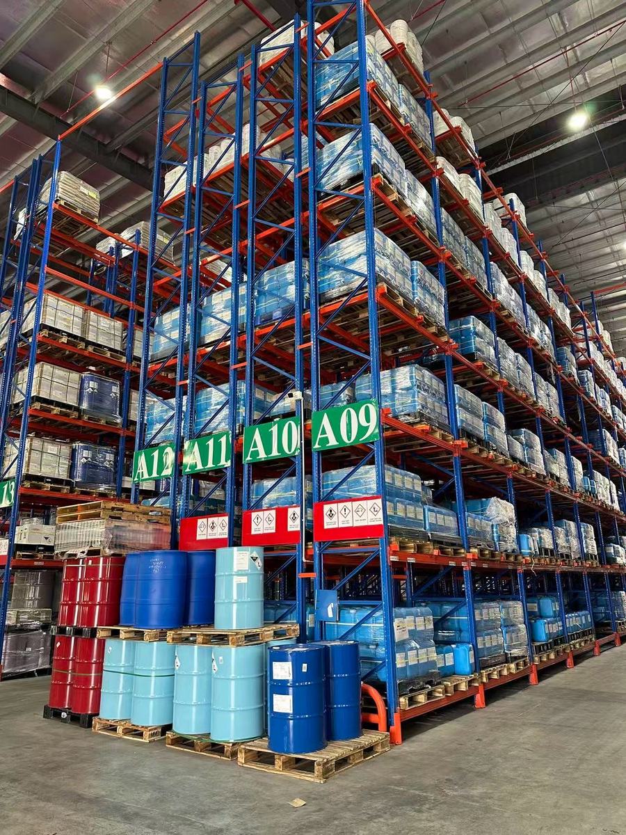 Chemical storage facility with labelled drums on racking